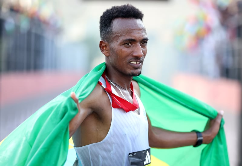 Abdisa Tola Adera of Ethiopia celebrates after winning the Dubai Marathon 2023. Getty