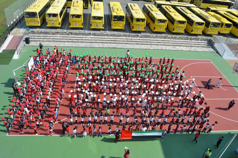 Pupils at The Indian High School in Dubai mark the day by creating a human flag.