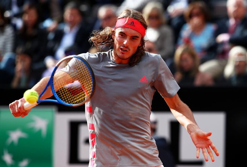 ROME, ITALY - MAY 18: Stefanos Tsitsipas of Greece plays a backhand against  Rafael Nadal of Spain in their semifinal match during day seven of the International BNL d'Italia at Foro Italico on May 18, 2019 in Rome, Italy. (Photo by Clive Brunskill/Getty Images)