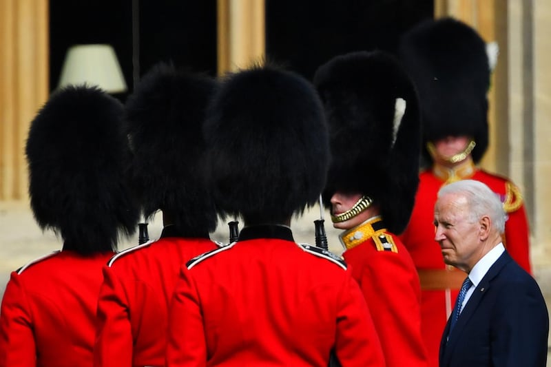 US President Joe Biden walks in front of members of the Royal Guard at Windsor Castle. Reuters
