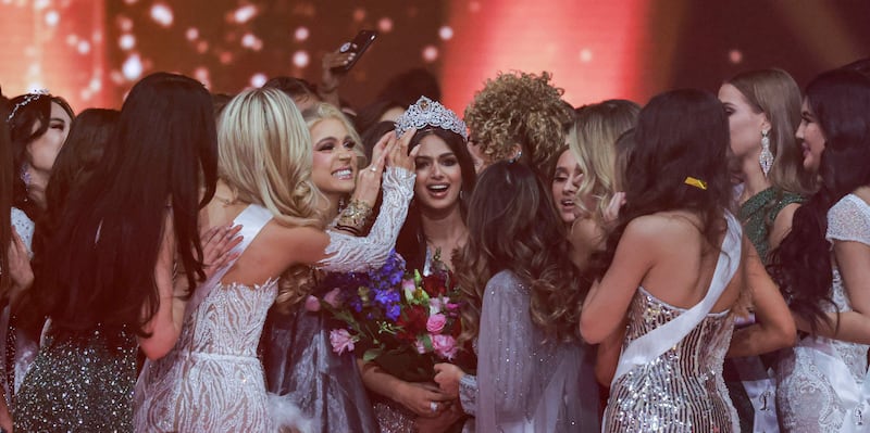 Miss Universe contestants congratulate Harnaaz Sandhu as she is crowned Miss Universe during the 70th Miss Universe beauty pageant. AFP