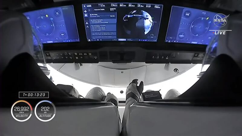 The crew monitoring their operation screens. Photo: NASA