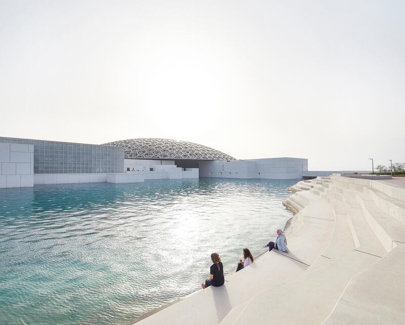 People sit by the Louvre in Abu Dhabi. DCT Abu Dhabi