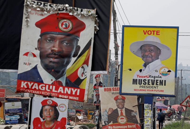 Elections billboards for Uganda's President Yoweri Museveni and Bobi Wine are seen on a street in Kampala. Reuters