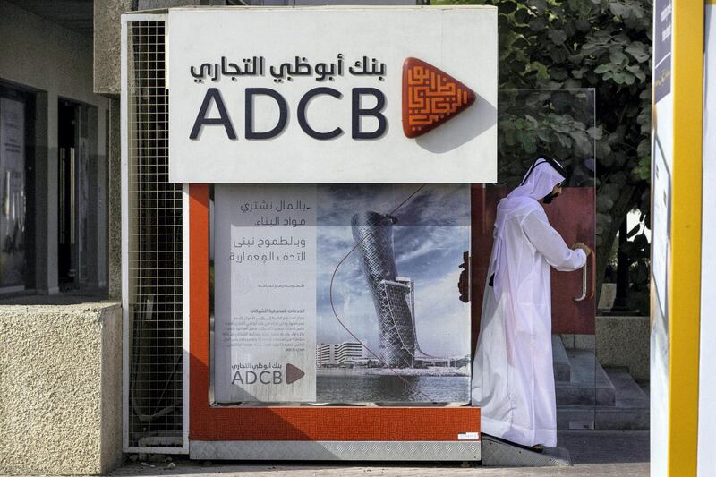 An Emirati man exits after using an Abu Dhabi Commercial Bank PJSC (ADCB) bank automated teller machine (ATM) in Dubai, United Arab Emirates, on Tuesday, Sept. 4, 2018. Abu Dhabi is engineering a second bank merger in its latest attempt to stay competitive in the era of lower oil prices. Photographer: Christopher Pike/Bloomberg