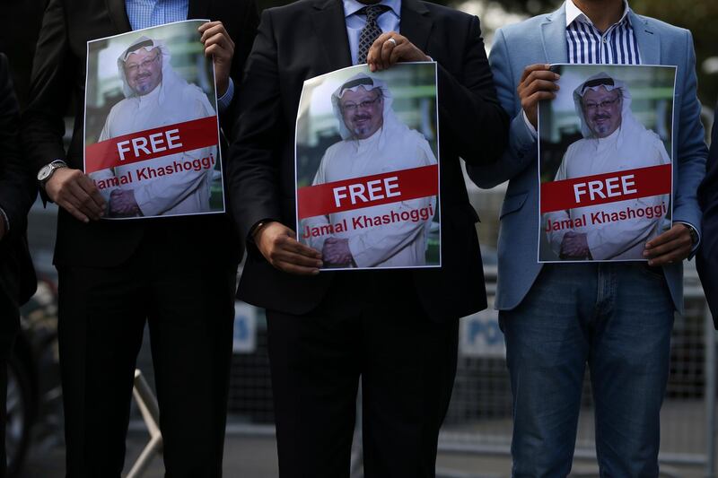 Holding pictures of missing Saudi writer Jamal Khashoggi, people gather in his support, near the Saudi Arabia consulate in Istanbul, Friday, Oct. 5, 2018. Khashoggi, a 59-year-old veteran journalist who has lived in self-imposed exile in the U.S. since Prince Mohammed's rise to power, disappeared Oct. 2 while on a visit to the consulate to get paperwork done to be married to his Turkish fiancee. The Saudi Consulate insists Khashoggi left its building, contradicting Turkish officials who say they believe he is still there. (AP Photo/Emrah Gurel)