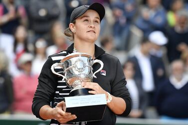 (FILE) - Ashleigh Barty of Australia poses with the trophy after winning the women's final match against Marketa Vondrousova of the Czech Republic during the French Open tennis tournament at Roland Garros in Paris, France, 08 June 2019 (re-issued 23 March 2022).  World No. 1 Ash Barty has announced her retirement from tennis 23 March 2022 at the age 25, less than two months after winning the Australian Open in Melbourne.   EPA / JULIEN DE ROSA *** Local Caption *** 55259134