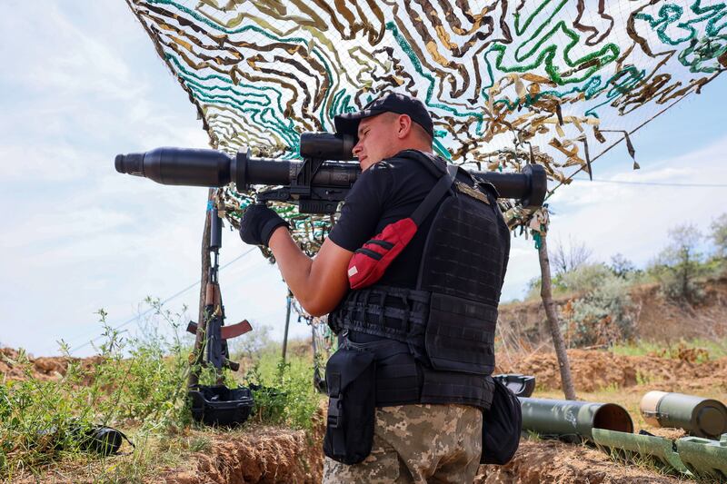 A Ukrainian army soldier holds a grenade launcher in the trenches near Odesa, Ukraine. EPA / Poland Out