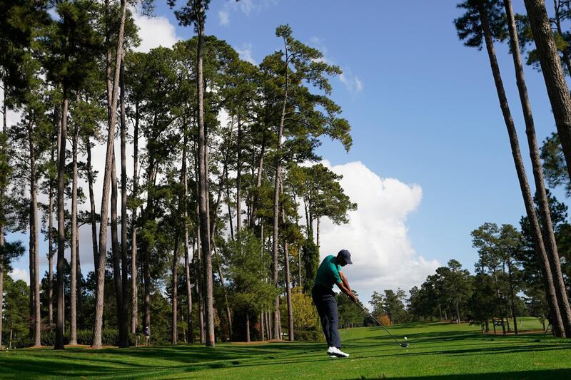 Tiger Woods tees off on the 17th hole during a practice round for the Masters. AP Photo