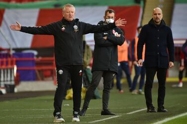 Sheffield United's English manager Chris Wilder (L) and Manchester City's Spanish manager Pep Guardiola look on during the English Premier League football match between Sheffield United and Manchester City at Bramall Lane in Sheffield, northern England on October 31, 2020. RESTRICTED TO EDITORIAL USE. No use with unauthorized audio, video, data, fixture lists, club/league logos or 'live' services. Online in-match use limited to 120 images. An additional 40 images may be used in extra time. No video emulation. Social media in-match use limited to 120 images. An additional 40 images may be used in extra time. No use in betting publications, games or single club/league/player publications. / AFP / POOL / Rui Vieira / RESTRICTED TO EDITORIAL USE. No use with unauthorized audio, video, data, fixture lists, club/league logos or 'live' services. Online in-match use limited to 120 images. An additional 40 images may be used in extra time. No video emulation. Social media in-match use limited to 120 images. An additional 40 images may be used in extra time. No use in betting publications, games or single club/league/player publications.