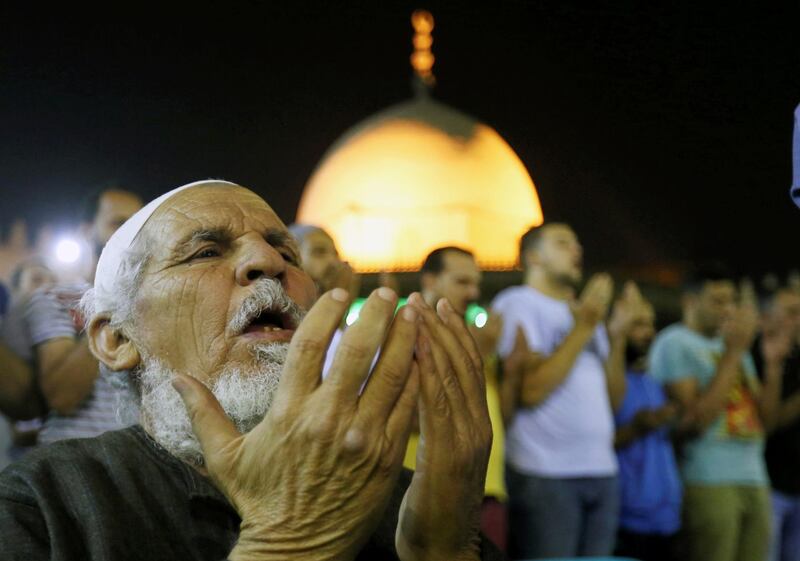 Egyptian Muslims take part in evening prayers on Laylat al-Qadr or Night of Decree, at Amr Ibn El-Aas mosque. Reuters