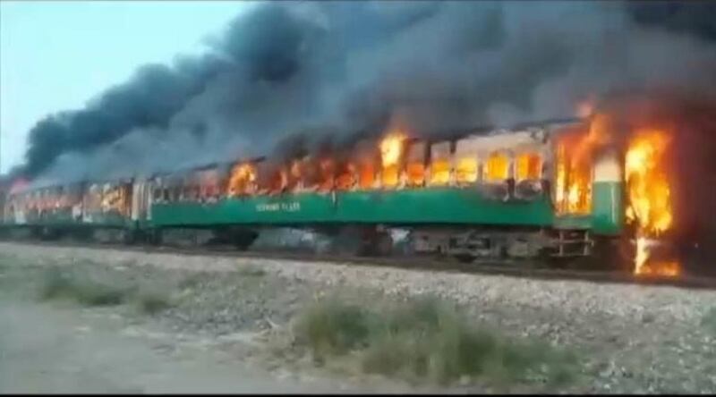 A fire burns a train carriage near the town of Rahim Yar Khan in the south of Punjab province, Pakistan October 31, 2019. Reuters