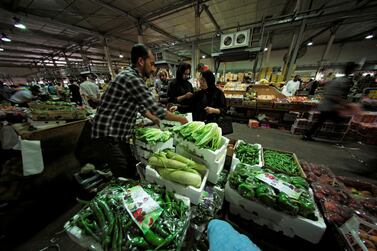 People shop at the Bahrain Central Market, ahead of the holy fasting month of Ramadan in Manama. Reuters