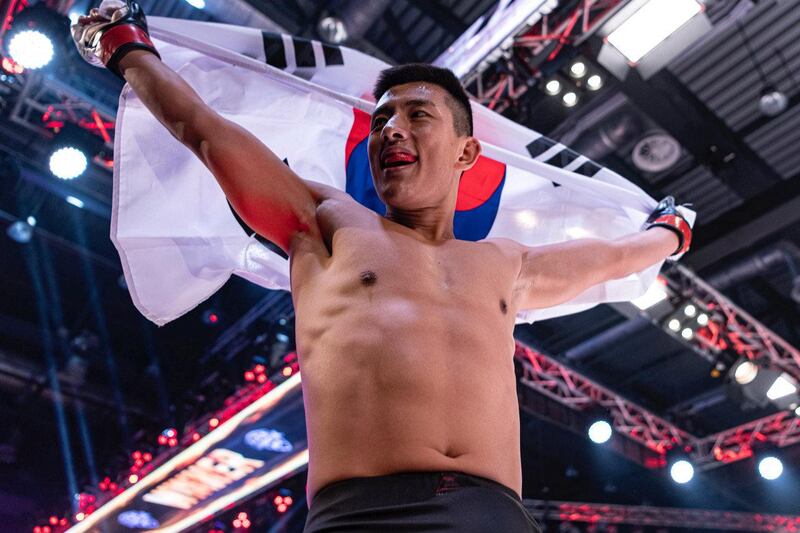Lee Do-gyeom reacts after his title win in the fetaherweight. credit to UAE Warriors 