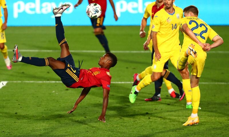 Ansu Fati attmpts an overhead kick against Ukraine. Reuters