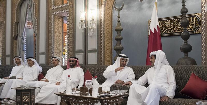 Sheikh Mohammed bin Zayed meets Sheikh Tamim bin Hamad Al Thani at Al Bahr Palace. With them are Sheikh Tahnoun bin Zayed, National Security Adviser, third right, Sheikh Mansour bin Zayed, fourth right, Ali Al Shamsi, fifth right, and Mohammed Al Mazrouei, left. Rashed Al Mansoori / Crown Prince Court - Abu Dhabi