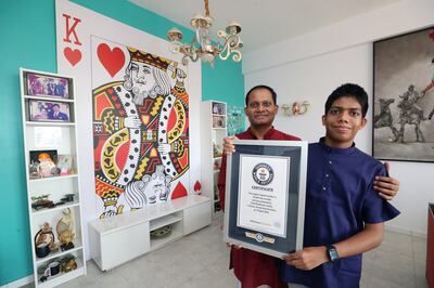 Amit has followed in the footsteps of his father, Ramkumar Sarangapani, who holds 18 Guinness World Records of his own, including the record for biggest playing card. Chris Whiteoak / The National