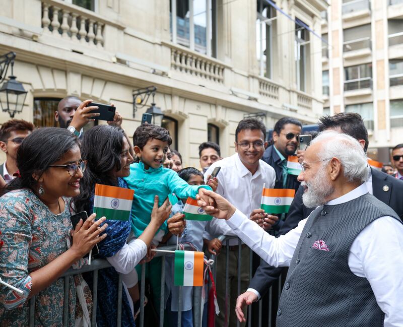 Mr Modi receives a warm reception from members of the Indian community in Paris. Photo: Indian Press Information Bureau