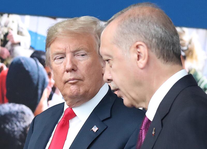 epa06943382 (FILE) - US President Donald J. Trump (L) looks at Turkey's President Recep Tayyip Erdogan (R) at NATO headquarters in Brussels, Belgium, 11 July 2018 (reissued 11 August 2018). Turkish President Erdogan condemned US President Trump's doubling of tariffs on Turkish steel and aluminium imports up to 50 percent. The Turkish lira plunged over 20 percent against the US dollar after Trump's announcement on 10 August 2018, which has been exacerbated over the disputed imprisonment of US pastor Andrew Brunson in Turkey.  EPA/TATYANA ZENKOVICH