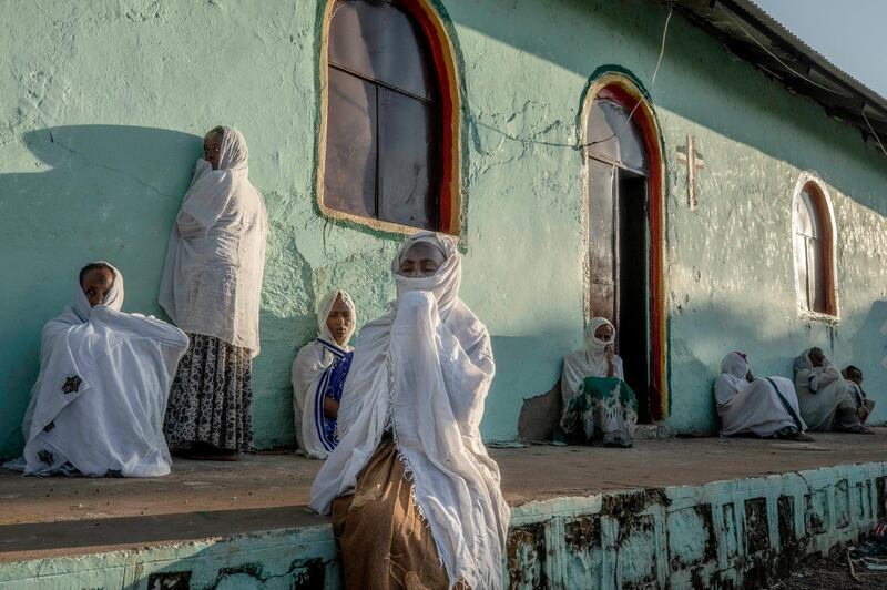 Tigrayan women who fled the conflict in Ethiopia's Tigray region, pray during Sunday Mass at a church, near Umm Rakouba refugee camp in Qadarif, eastern Sudan. AP