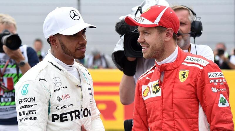 Lewis Hamilton, left, leads Sebastian Vettel by 24 points in the drivers' standings. AFP