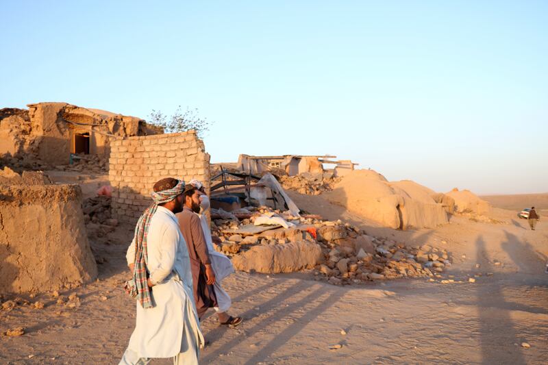 People wait for relief in Herat, Afghanistan, with rescue efforts continuing. EPA