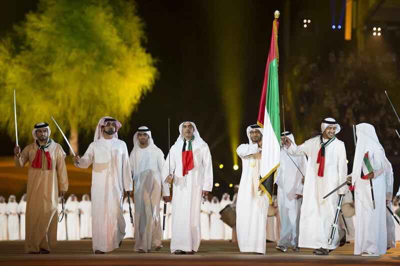 Lt Genl Sheikh Saif bin Zayed, Deputy Prime Minister and Minister of Interior (4th L) dances at the end of the 44th UAE National Day celebrations held at Zayed Sports City. Seen with Sheikh Ammar bin Humaid, Crown Prince of Ajman (2nd L), Sheikh Abdullah bin Zayed, Minister of Foreign Affairs (2nd R) and other dignitaries. Mohamed Al Suwaidi / Crown Prince Court - Abu Dhabi