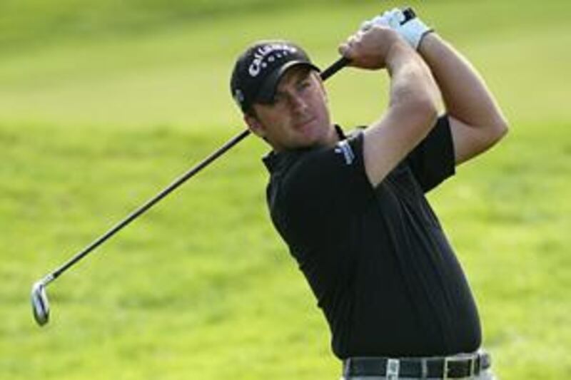 Graeme McDowell hits an approach shot at Loch Lomond.