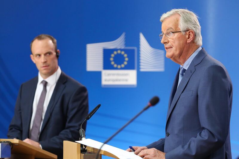 Michel Barnier, chief negotiator for the European Union (EU), right, speaks as Dominic Raab, U.K. exiting the European Union (EU) secretary, listens during a news conference in Brussels, Belgium, on Thursday, July 26, 2018. Barnier rejected the central part of the U.K.'s proposal for a trade deal, in a blow to hopes of reaching an agreement by October. Photographer: Yuriko Nakao/Bloomberg