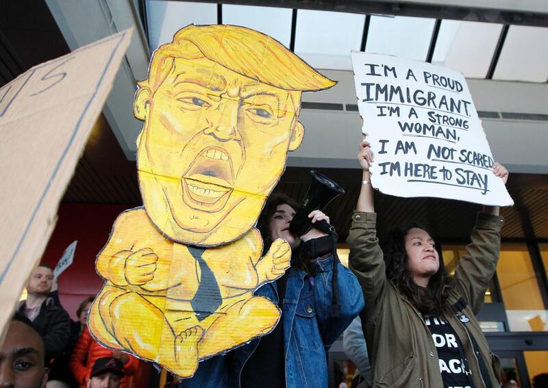 Protests have sprung up against Donald Trump's policies across the US, including this one outside an airport in Atlanta, Georgia AFP / TAMI CHAPPELL
