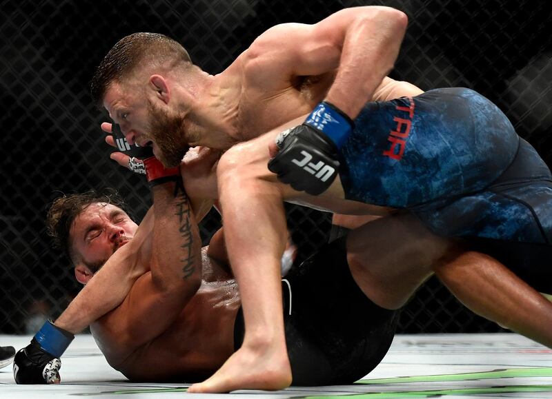 JACKSONVILLE, FLORIDA - MAY 09: Calvin Kattar (top) of the United States punches Jeremy Stephens (bottom) of the United States on the ground in their Featherweight fight during UFC 249 at VyStar Veterans Memorial Arena on May 09, 2020 in Jacksonville, Florida.   Douglas P. DeFelice/Getty Images/AFP