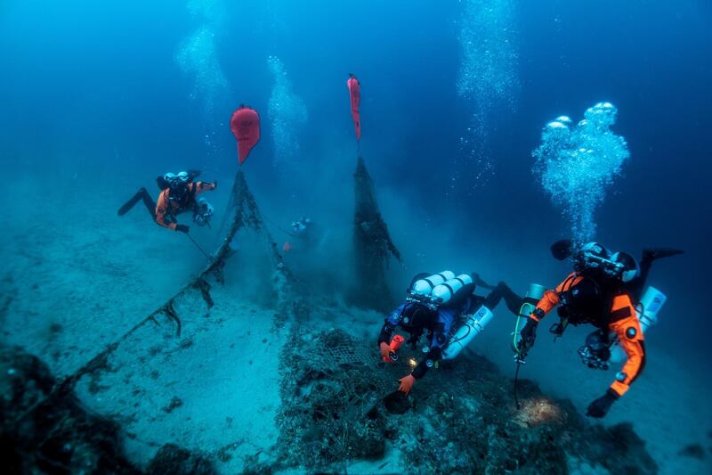 Inflated lifting bags are seen attached to a fishing net as divers of the environmental group Ghost Diving work near the WWII wreck of the HMS Perseus, off the island of Kefalonia, Greece. Reuters