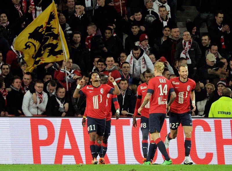 Ryan Mendes, left, of Lille celebrates his goal on Saturday. Philippe Huguen / AFP