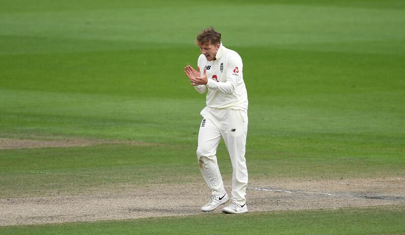 MANCHESTER, ENGLAND - AUGUST 07: Dom Bess of England celebrates the wicket of Abid Ali of Pakistan  during Day Three of the 1st #RaiseTheBat Test Match between England and Pakistan at Emirates Old Trafford on August 07, 2020 in Manchester, England. (Photo by Gareth Copley/Getty Images for ECB)