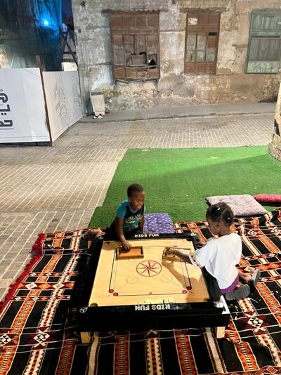 Children playing carom in Al Balad. Photo: Mariam Nihal