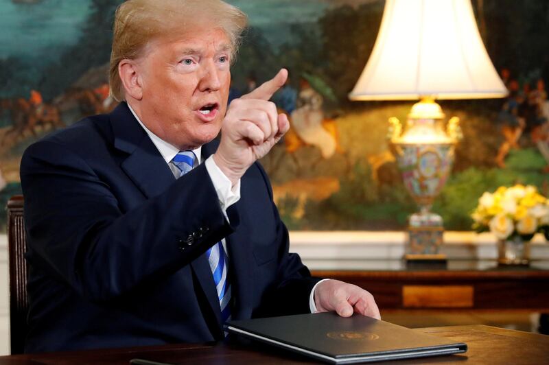 FILE PHOTO: U.S. President Donald Trump speaks to reporters at the White House after signing a proclamation declaring his intention to withdraw the United States from the 2015 nuclear deal with Iran, May 8, 2018.  REUTERS/Jonathan Ernst/File Photo