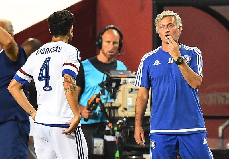Jose Mourinho, right, speaks to Cesc Fabregas during an International Champions Cup match in Landover, Maryland. Nicholas Kamm / AFP 

