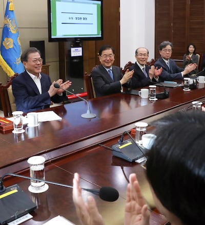 epa08208264 South Korean President Moon Jae-in (L) and his top secretaries react after hearing the news that South Korean director Bong Joon-ho won four Academy Awards, prior to a meeting at the presidential office in Seoul, South Korea, 10 February 2020. Bong Joon-hoâ€™s movie Parasite won four Academy Awards on 09 February for Best Original Screenplay, Best International Feature Film, Best Director and Best Picture. It is the first time a foreign-language movie wins the Academy Award for Best Picture.  EPA/YONHAP SOUTH KOREA OUT