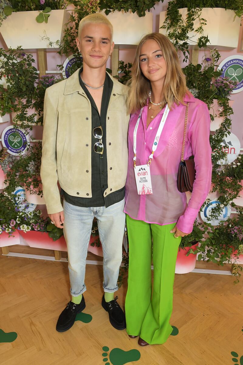 Romeo Beckham and Mia Regan pose in Evian's VIP suite during day one of The Championships, Wimbledon 2021.