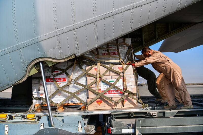 Humanitarian aid bound for Gaza via Egypt being loaded into a military aircraft at Kuwait International Airport. AFP