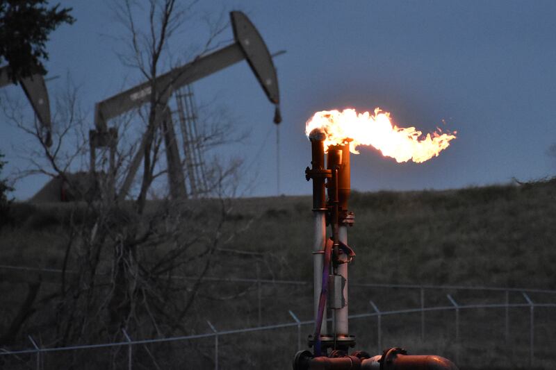 A flare to burn methane from oil production near Watford City, North Dakota. The oil and gas industry's Cop28 methane pledge has been praised, but concerns linger about its implementation. AP