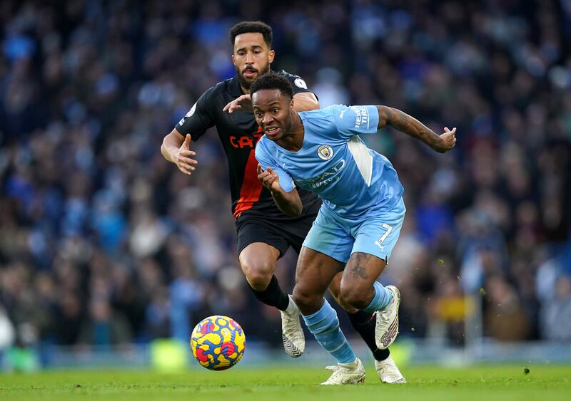 Manchester City's Raheem Sterling under pressure from  Andros Townsend of Everton. PA