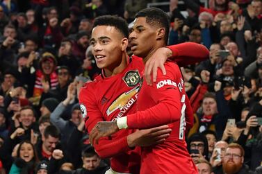 Manchester United's English striker Marcus Rashford (R) celebrates with Manchester United's English striker Mason Greenwood (L) after scoring their third goal during the English Premier League football match between Manchester United and Newcastle United at Old Trafford in Manchester, north west England, on December 26, 2019. RESTRICTED TO EDITORIAL USE. No use with unauthorized audio, video, data, fixture lists, club/league logos or 'live' services. Online in-match use limited to 120 images. An additional 40 images may be used in extra time. No video emulation. Social media in-match use limited to 120 images. An additional 40 images may be used in extra time. No use in betting publications, games or single club/league/player publications. / AFP / Paul ELLIS / RESTRICTED TO EDITORIAL USE. No use with unauthorized audio, video, data, fixture lists, club/league logos or 'live' services. Online in-match use limited to 120 images. An additional 40 images may be used in extra time. No video emulation. Social media in-match use limited to 120 images. An additional 40 images may be used in extra time. No use in betting publications, games or single club/league/player publications.