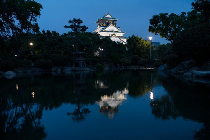 The Osaka Castle is reflected in a pond at dusk Wednesday, June 26, 2019, in Osaka, western Japan. Osaka is hosting the two-day G-20 summit that starts Friday. (AP Photo/Jae C. Hong)