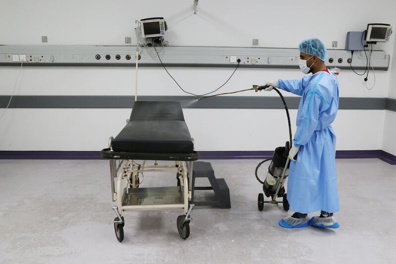 A worker disinfects a room where patients undergo tests for the coronavirus disease at Rafik Hariri University Hospital in Beirut, Lebanon. REUTERS