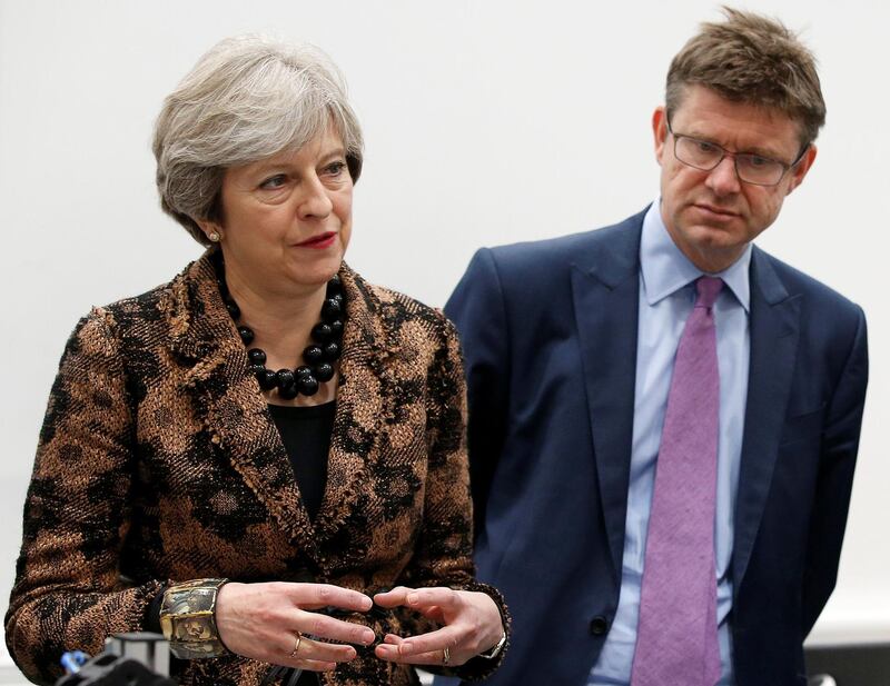 Britain's Prime Minister Theresa May (L) and Britain's Business, Energy and Industrial Strategy Secretary Greg Clark visit an engineering training facility in the Birmingham, central England, on November 20, 2017.

British finance minister Philip Hammond is to announce £75 million ($99 million, 84 million euros) funding for Artificial Intelligence and plans to put driverless cars on UK roads by 2021, in his budget speech on Wednesday. Hammond will announce regulation changes to allow Britain's driverless car industry, which the government estimates will be worth £28 billion by 2035, to get cars on the road within as little as three years, according to extracts of the budget released by his office on Sunday. / AFP PHOTO / POOL / Andrew YATES