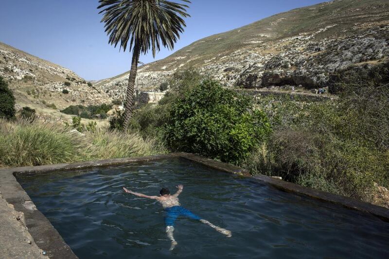 A Palestinian youth from Hebron enjoys a swim in Ein Farha, considered to be one of the most beautiful nature spots in the entire West Bank. It, like many other nature reserves and heritage sites in the West Bank, is managed by the Israeli Nature and Parks Authority. Courtesy Tanya Habjouqa