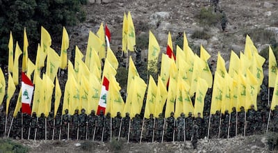 Hezbollah militia members listening to the speech of their leader Hassan Nasrallah via a giant screen on August 14, 2015, during the 'Victory Festival' to mark the 9th anniversary of the end of the 2006 July War. EPA