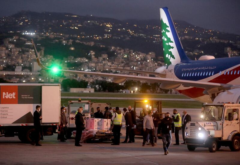 The first batch of the shipment of the Pfizer-BioNTech Covid-9 vaccine is offloaded from a plane at Beirut's international airport. Reuters