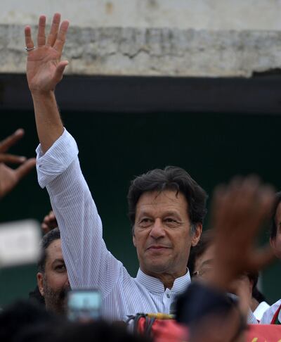 Imran Khan (C), Pakistani cricketer-turned-opposition leader and head of the Pakistan Tehreek-i-Insaf (PTI), delivers a speech during an election campaign in in Mianwali, some 240 kms southwest of Islamabad, on June 24, 2018. Pakistani cricket star-turned-politician Imran Khan on June 24 kicked off his election campaign by staging a major rally and promising sweeping changes in the country, once his party win the elections. / AFP / AAMIR QURESHI
